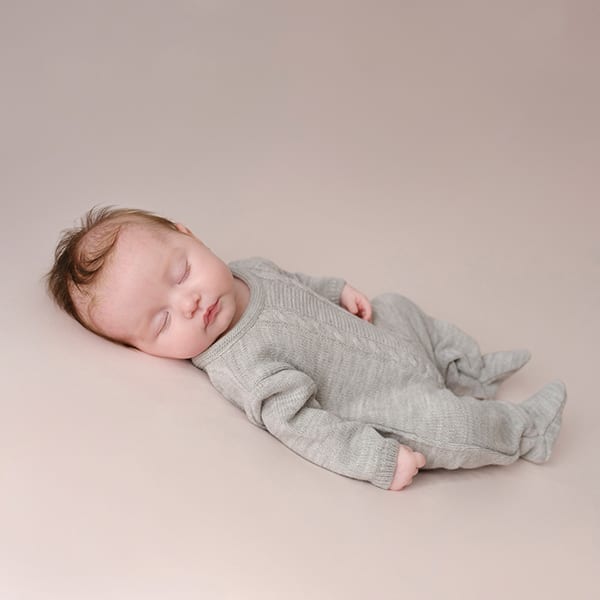 Grey cable knitted newborn onesie Spilsby